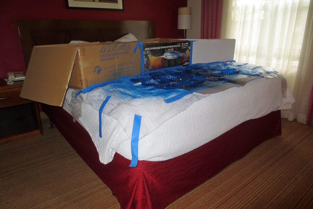 spray painted parts on hotel bed.JPG